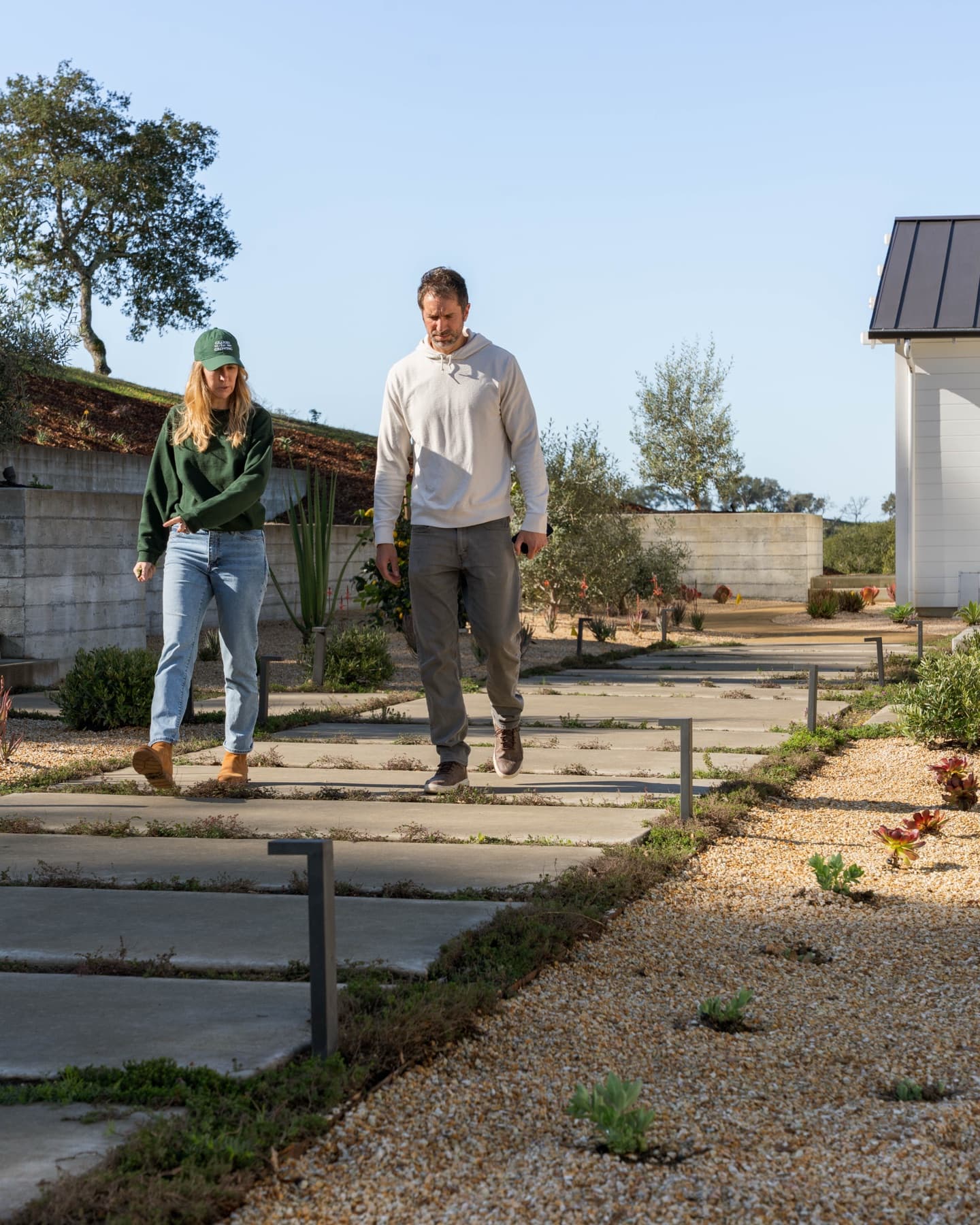 Megan Mokri walking a completed landscape with a project collaborator
